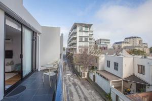 an apartment balcony with a view of a city at Boutique Stays - Sea Breeze at Port in Melbourne