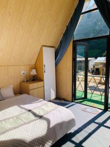 Postel nebo postele na pokoji v ubytování Bungalow Pả Vi