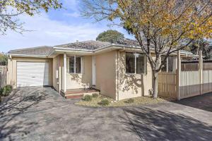 a house with a driveway in front of it at Boutique Stays - The Richardson in Mentone