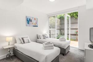 En eller flere senge i et værelse på Boutique Stays - Brighton By Sea