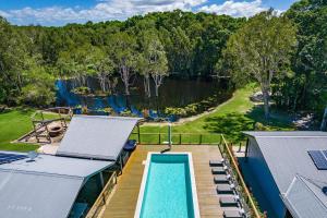 an aerial view of a house with a swimming pool at A Perfect Stay - Lennox Coastal Retreat in Lennox Head