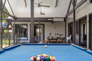 a pool table in the middle of a room at A Perfect Stay - Lennox Coastal Retreat in Lennox Head
