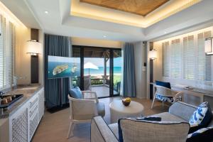 a living room with a view of the ocean at Layana Resort & Spa - Adult Only - SHA Extra Plus in Ko Lanta