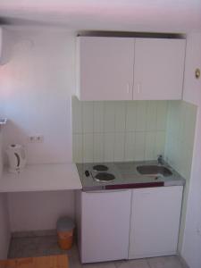 Kuchyňa alebo kuchynka v ubytovaní Linda Apartment