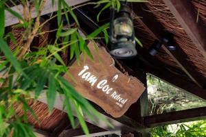 a sign hanging from the ceiling of a building at Tam Coc Retreat Ninh Binh in Ninh Binh