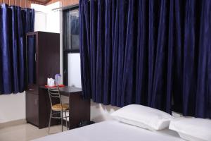 Postel nebo postele na pokoji v ubytování ACE SUITES