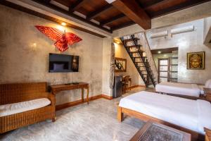 Nirmala Guest House Surf Keramas客房内的一张或多张床位
