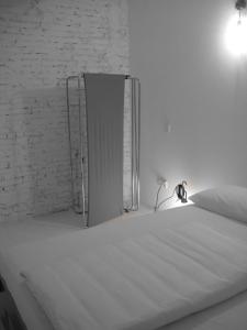 Postel nebo postele na pokoji v ubytování Legrenzi Rooms