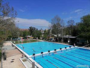 a large swimming pool with many swimmers in it at Hód-Thermal Camping in Hódmezővásárhely