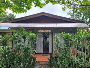 a small building with a sign that reads garden workshops at VISTA MIRAVALLES - Rio Celeste Dreams in Bijagua