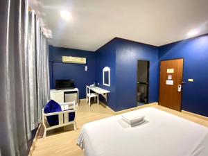 Postel nebo postele na pokoji v ubytování Rimtarn Hotel Pakchong + 23 fotografií