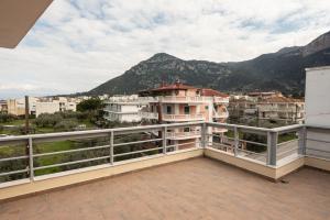 a balcony with a view of a mountain at Seacoast apartments 3 ! in Kamena Vourla
