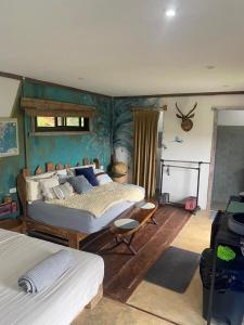 a bedroom with two beds in a room at Torio sea view in Torio +13 photos