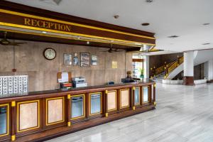 a lobby of a hotel with a reception counter at Welcome Plaza Hotel Pattaya in Pattaya +73 photos