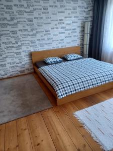 a bedroom with a bed with two pillows on it at Apartmán Radenice 