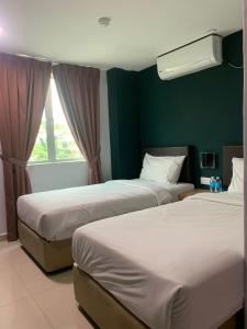 Posteľ alebo postele v izbe v ubytovaní Room V Jalan Megat by SECOM