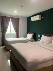Posteľ alebo postele v izbe v ubytovaní Room V Jalan Megat by SECOM