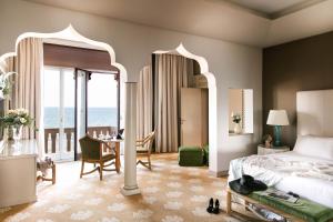 Postel nebo postele na pokoji v ubytování Hotel Excelsior Venice