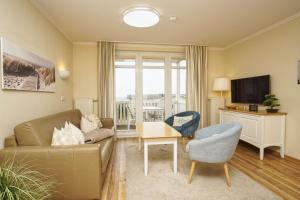 TV/Unterhaltungsangebot in der Unterkunft mit Meerblick und Balkon, gratis Nutzung vom AHOI Erlebnisbad und Sauna in Sellin - Meeresblick FeWo 38