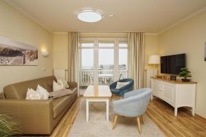 TV/Unterhaltungsangebot in der Unterkunft mit Meerblick und Balkon, gratis Nutzung vom AHOI Erlebnisbad und Sauna in Sellin - Meeresblick FeWo 38