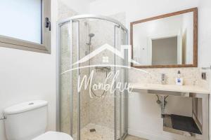 a bathroom with a shower and a sink and a mirror at Villa Colom in Son Carrio +10 photos