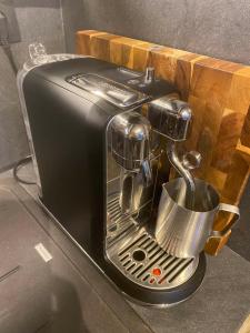 a toaster sitting on a counter with a cup at Villa ELi - Luxury Nature Getaway - Strategically located for Beach Exploration - Onsite Power for Electric Vehicle in Fourka