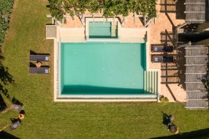 an overhead view of a swimming pool in a yard at Sarlata Villas in Sarlata