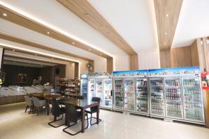 a store with a table and chairs in a room at SunSeaSand Hotel Patong - SHA Certified in Patong Beach