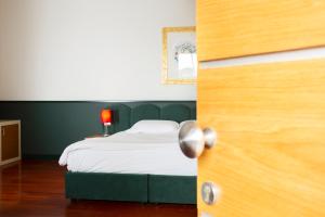 Postel nebo postele na pokoji v ubytování Hotel Ghalà