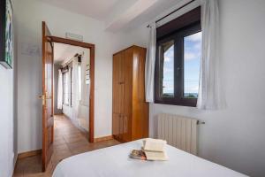 Łóżko lub łóżka w pokoju w obiekcie Casa rural Cuchia con vistas