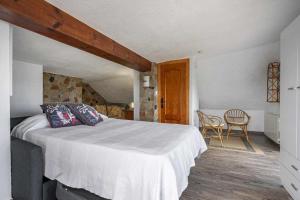 Łóżko lub łóżka w pokoju w obiekcie Casa rural Cuchia con vistas