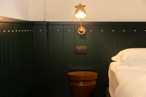 Postel nebo postele na pokoji v ubytování Hotel Ghalà