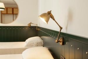 Postel nebo postele na pokoji v ubytování Hotel Ghalà