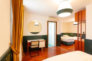 Postel nebo postele na pokoji v ubytování Hotel Ghalà