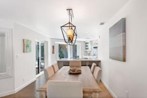 a dining room with a table and chairs at 265 Gladiolus Home in Anna Maria