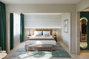 a bedroom with a large bed and green curtains at The Yarn in Horgen