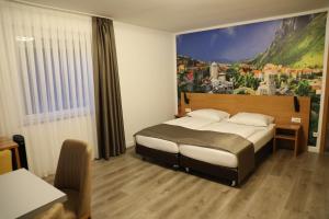 Postel nebo postele na pokoji v ubytování Hotel Schlangenbader Hof