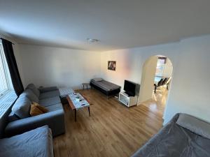 a living room with a couch and a table at Apartment in central Kiruna 3 in Kiruna