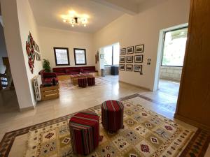 a living room with a couch and a table at Lemon Tree Residence in Amman