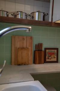 a bathroom with a sink and some wooden blocks on a counter at Stunning Designer 2 Bed Apt in Glorious Gràcia in Barcelona