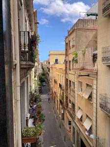 a view of a city street with buildings at Stunning Designer 2 Bed Apt in Glorious Gràcia in Barcelona
