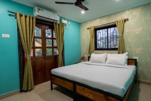 מיטה או מיטות בחדר ב-Destino Hotel, Goa