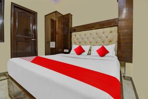 Postelja oz. postelje v sobi nastanitve OYO Flagship Hotel Alsafar India