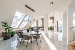 a dining room with a table and chairs at Z Penthouse B in Berlin