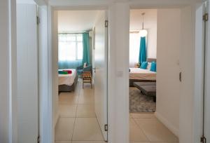 Voodi või voodid majutusasutuse Luxury beachfront duplex, Coin de Mire view / 3Bed toas