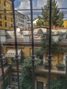 a view from a balcony of a building with plants at MARCONA 1 - City Centre Apt with Terrace in Milan