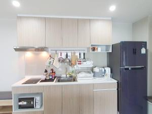 a kitchen with a sink and a refrigerator at Family Condo-style in Phra Nakhon Si Ayutthaya
