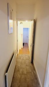 a hallway with a hallway leading into a room at North London Property in London