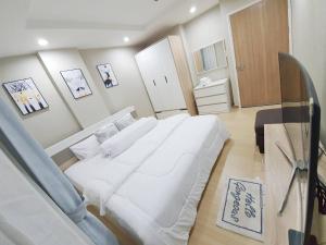 Postel nebo postele na pokoji v ubytování Family Condo-style