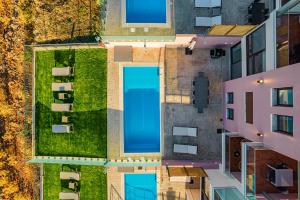 an overhead view of an apartment building with a pool at Villa Mari Chania, with private ecologic pool and amazing view! in Chania Town